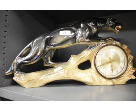 A 1930's Jema Holland ceramic mantel clock in the form of a Panther, in good condition.