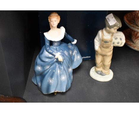 A Royal Doulton Fragrance figurine HN2334 boxed with a Nao figure of a boy holding a football