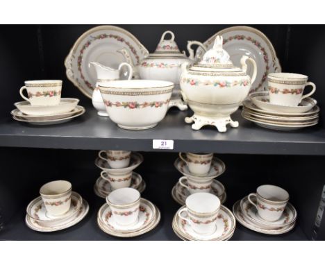 A Victorian porcelain part tea service having white ground with gilt decoration and enamel detailing.