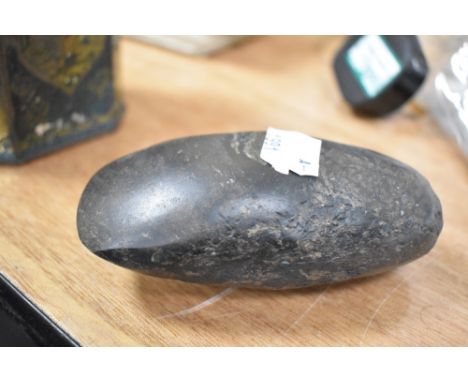 A Neolithic period stone carved axe head aprox 10cm long.
Unsure of provenance or where this item was found.