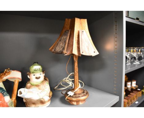 A mid century Spanish styled copper lamp and shade.