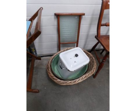 An enamel bread bin, an enamel baby bath, a glass wash board and a wicker basket