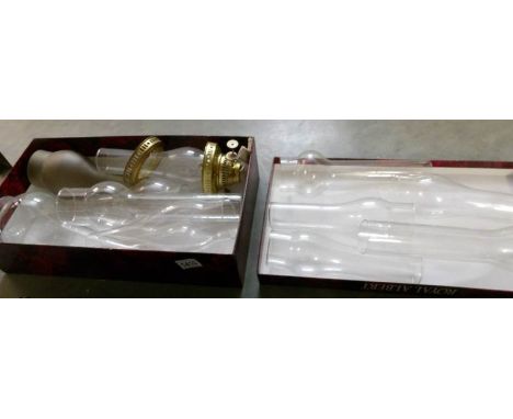 2 boxes of glass oil lamp chimneys and a brass burner