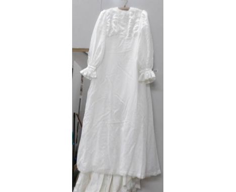 A vintage hand made wedding dress, early 1970's