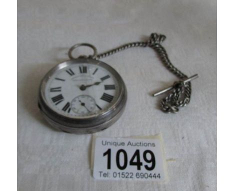A silver pocket watch a/f, on a  silver chains, another silver chain  and a watch chain