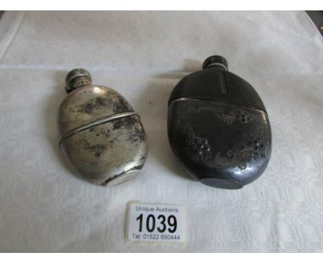 A silver hip flask and one other