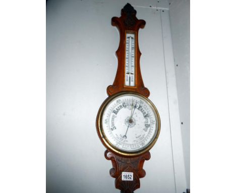 An Edwardian oak aneroid barometer