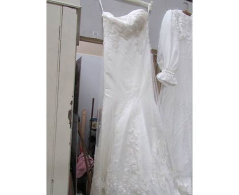 A vintage wedding dress with long train