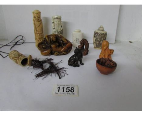 A mixed lot of oriental perfume bottles, netsuke etc
