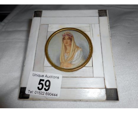 A miniature portrait of a lady, possibly French, signed R Milor?
