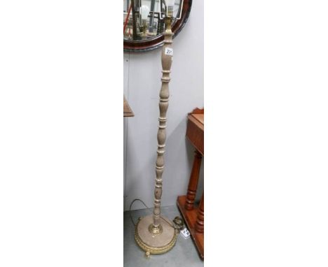 A gilded standard lamp base