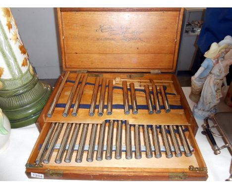 A vintage Hawkes & Son, London cased 2 layer xylophone