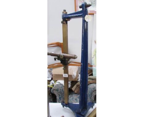 A large sighting instrument mounted on an adjustable brass and cast iron stand by The Precision Tool Makers, Surrey, England 