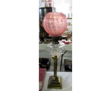 A Victorian brass corinthian column oil lamp with later shade