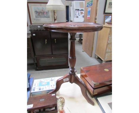 A mahogany tripod wine table with Tudor rose carved in top