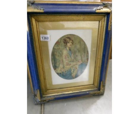 A framed and glazed portrait print