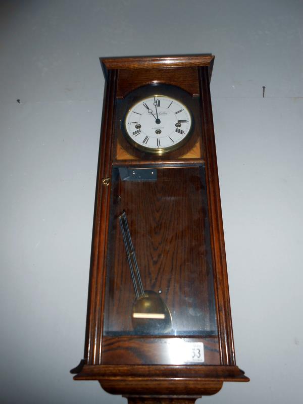 A Knight & Gibbins, London oak Westminster chime wall clock