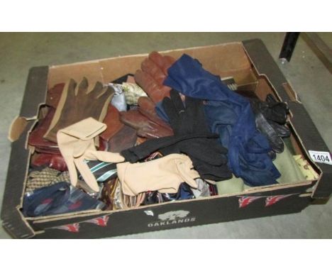 A box of vintage gloves, leather wallets, ties etc