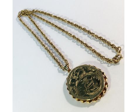 An engraved 9ct gold locket on 9ct gold chain, 16.7 gms