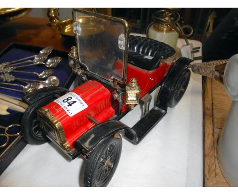A large vintage style tin plate car