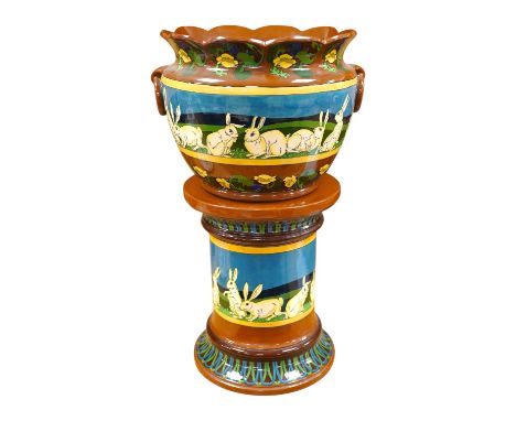A large Foley Intarsio jardiniere on stand, designed by Frederick Rhead, decorated with rabbits, 60cm high. Condition - resto