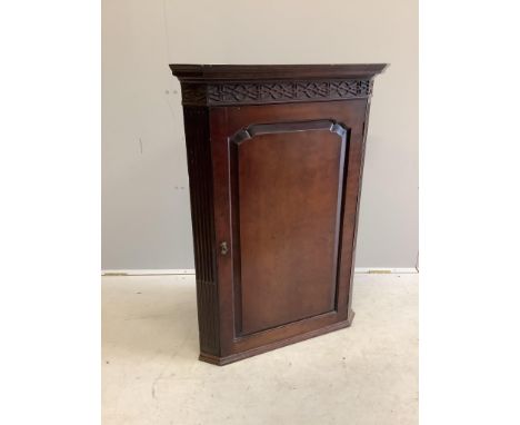 A George III Chippendale style mahogany hanging corner cabinet, width 75cm, depth 41cm, height 102cm. Condition - fair to goo