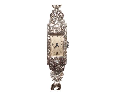 A lady's mid 20th century white metal (stamped platinum) and diamond set manual wind cocktail watch, on a 9ct white metal twi
