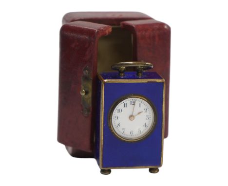 An early 20th century enamelled metal miniature carriage timepiece, cased, 6cm tall. Condition - case poor to fair, clock fai
