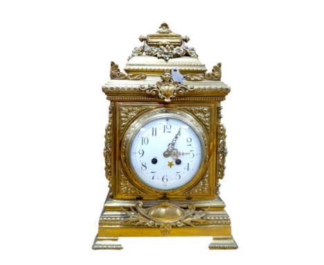 A Louis XVI style ormolu mantel clock with enamel dial, key and pendulum, 42cm. Condition - fair to good
