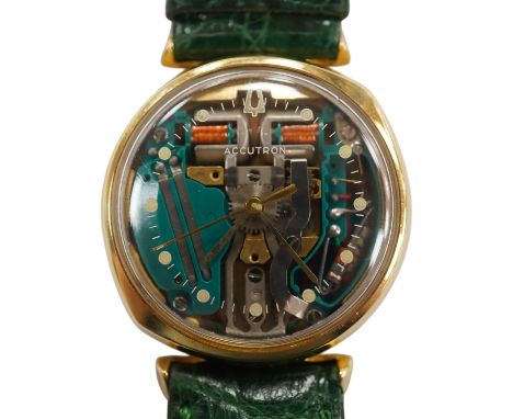A gentleman's 1970's 14k Bulova Accutron wrist watch, the case back numbered 077471, case diameter 33mm, on a later associate