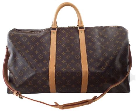 A Louis Vuitton monogram Keepall Bandoulière 55 luggage bag, the maker's monogram coated canvas with smooth leather trim, dou