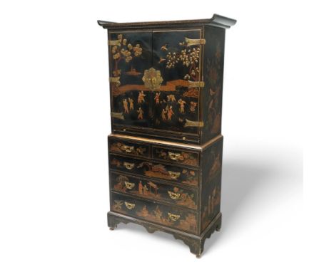 Early 20th century black lacquered and chinoiserie decorated cabinet-on-chest, altar top over two doors and slide, the doors 
