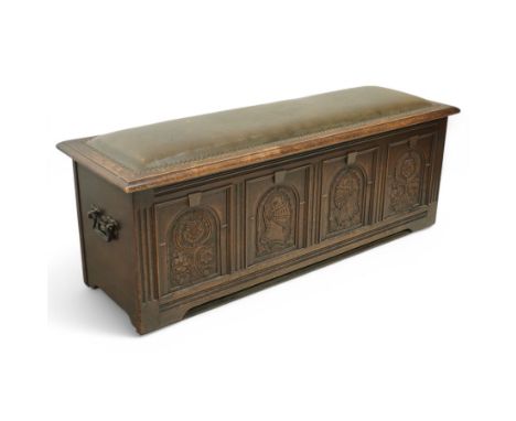 17th century design carved oak window seat or blanket box, upholstered hinged lid with moulded surround, the interior fitted 