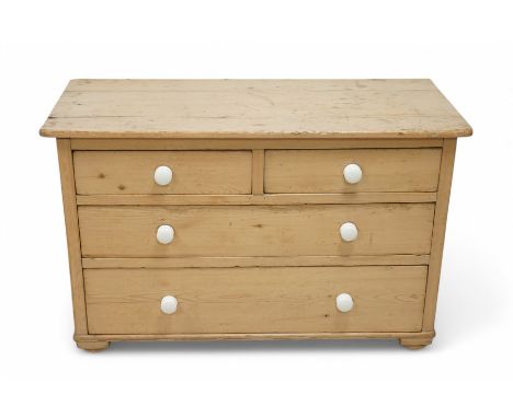 Victorian waxed pine chest, rectangular top over two short and two long drawers, fitted with white ceramic handles, on turned