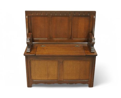 Late 20th century oak monk's bench, hinged triple panelled top over box seat, panelled front on stile supports Dimensions: He