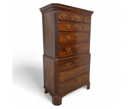 George III mahogany canted chest-on-chest, moulded cornice over three short and six long moulded drawers, shaped and pierced 
