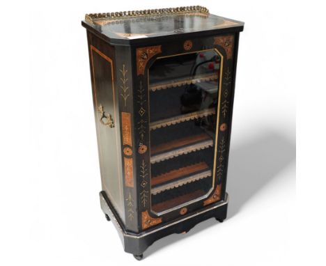 Late Victorian Aesthetic Movement ebonised music cabinet, inlaid with figured panels with foliate inlay, decorated with carve