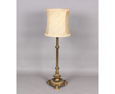 A late Victorian brass telescopic lamp standard, raised on a reeded stem and lobed circular base, extended height 190cm.Buyer