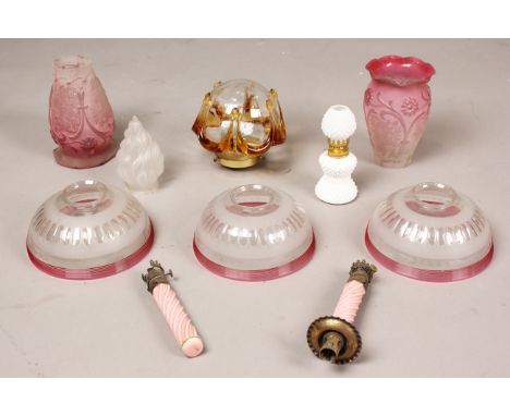 A group of Victorian and later glass lamp shades, including a set of three frosted glass shades with red trailed edge, diamet