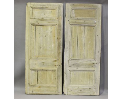 A large pair of 19th century pine two-section panelled doors, comprising two large sections, 239cm x 93cm, and two smaller si