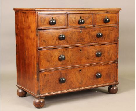 A 19th century George I style walnut chest of three short and three long drawers with turned bun handles, on bun feet, height