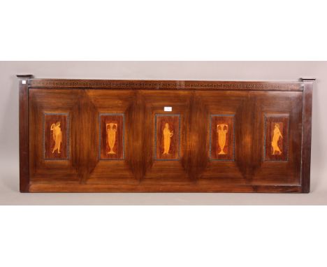An Edwardian mahogany panel, marquetry inlaid with five reserves depicting two Grecian urns and three female figures, beneath