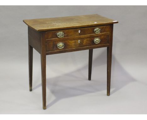 A George III figured mahogany lowboy with boxwood stringing, the two drawers with bone key escutcheons, on square tapering le