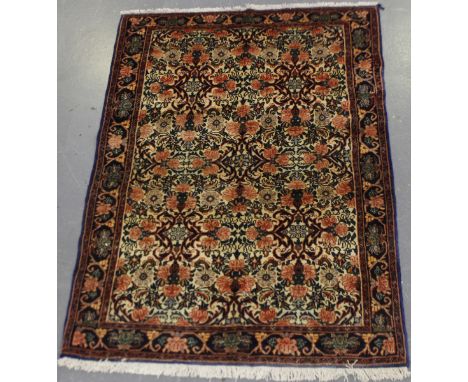 A Bidjar rug, North-west Persia, mid/late 20th century, the ivory field with an overall rose lattice, within a cartouche bord