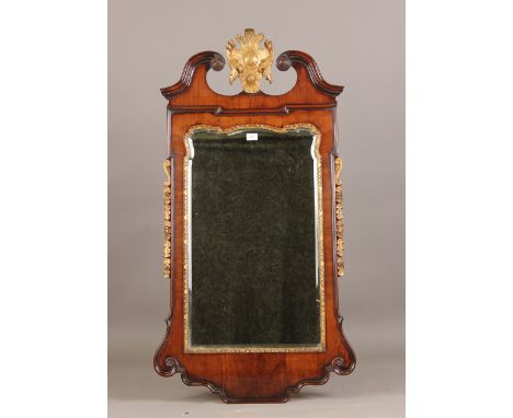 A good 19th century George I style walnut and gilded wall mirror, the swan neck pediment with a shaped cartouche crest above 