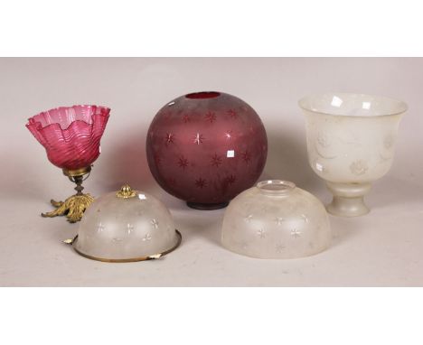 A Victorian frosted pink glass globular lamp shade with overall cut stars, diameter 31cm, together with two similar domed sha