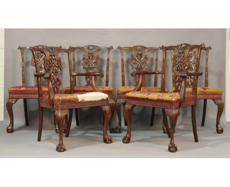 A set of six early 20th century Chippendale style mahogany dining chairs with finely carved and pierced backs above cabriole 