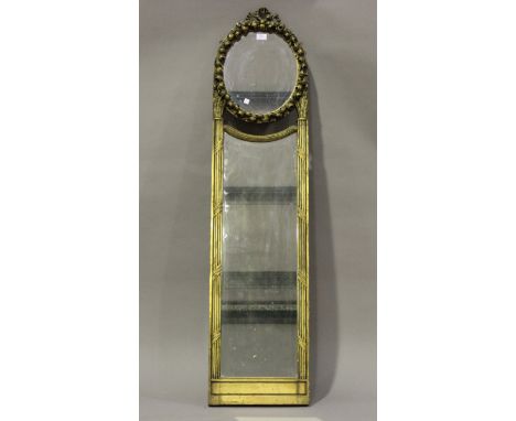A late 19th/early 20th century carved giltwood and gesso two-section pier mirror with ribbon surmount, flower and stiff leaf 