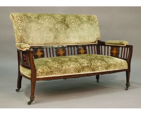 An Edwardian mahogany two-seat salon settee, the five back supports inlaid with boxwood fan and palmette motifs, height 84cm,