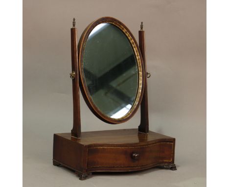 A 19th century mahogany swing frame mirror, the serpentine base fitted with a drawer, height 53cm, width 41cm.Buyer’s Premium